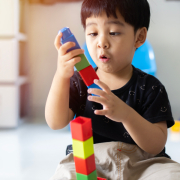 happy-cute-little-asian-child-boy-play-with-plastic-blocks-construction-floo