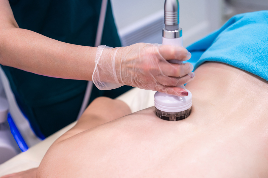 RF massage. Hardware cosmetology. Young woman getting rf lifting procedure in a beauty parlour.