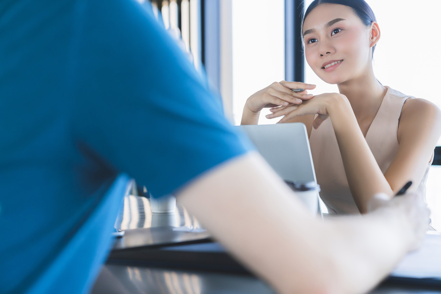 business meeting with asian investor woman and coworker discuss